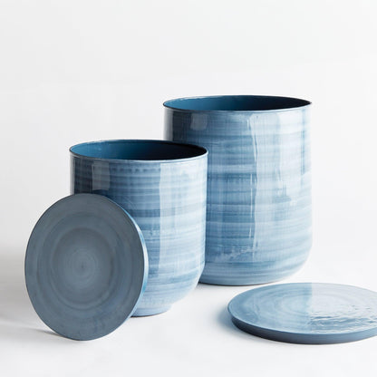 Two blue painted side tables with lids 