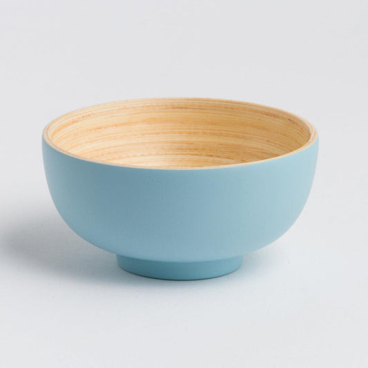 a blue bowl with a wooden rim on a white background