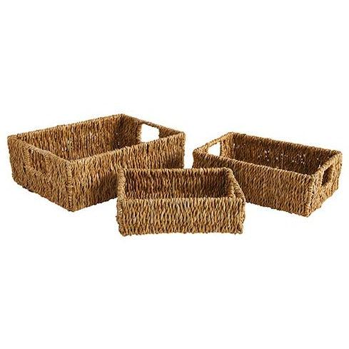 a set of three woven baskets on a white background