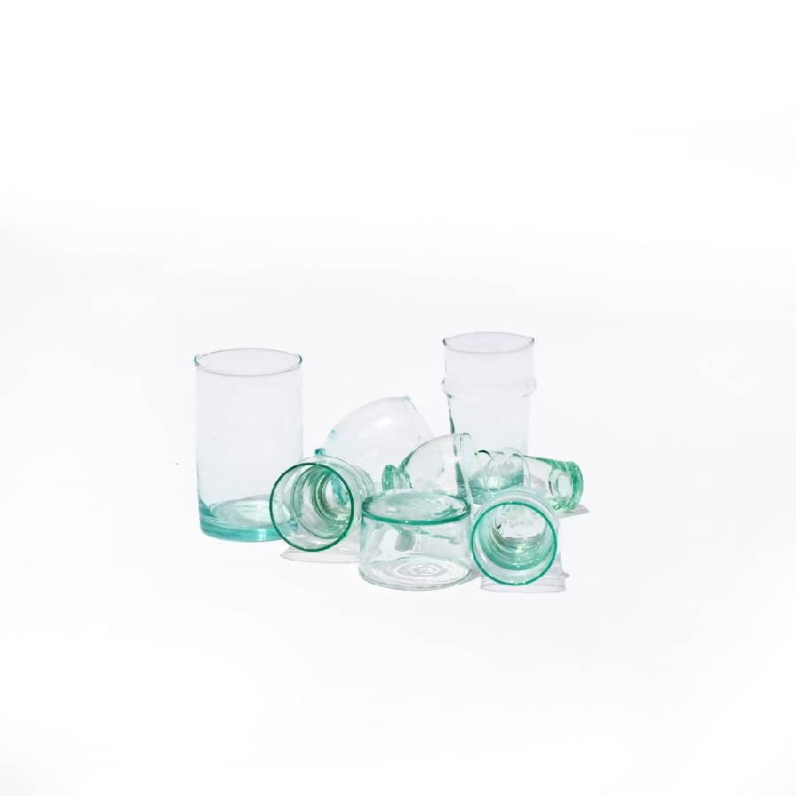 a group of glass cups sitting next to each other