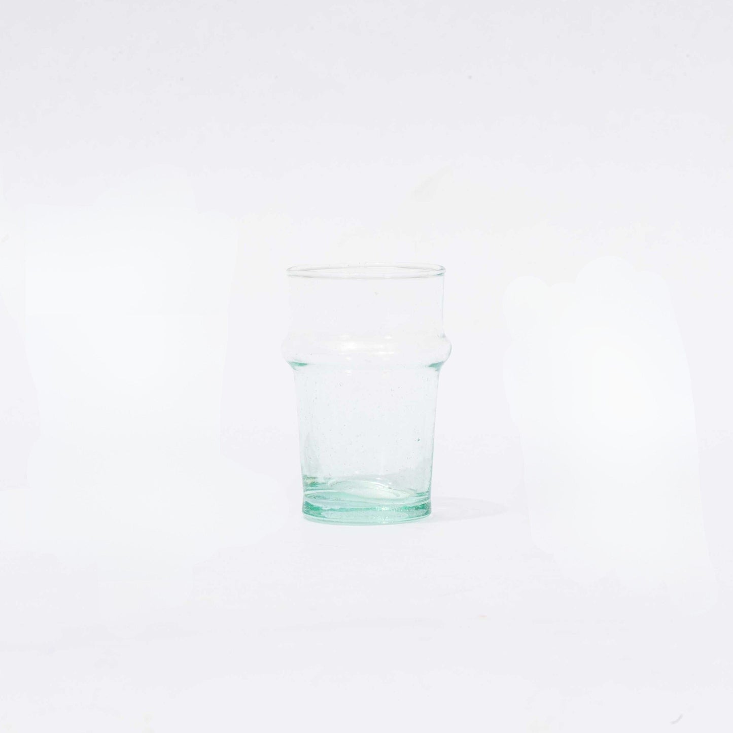 a glass of water on a white background