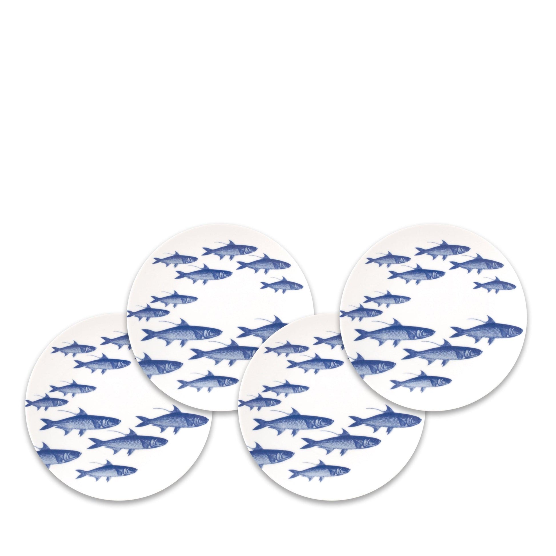 a set of four blue and white fish coasters