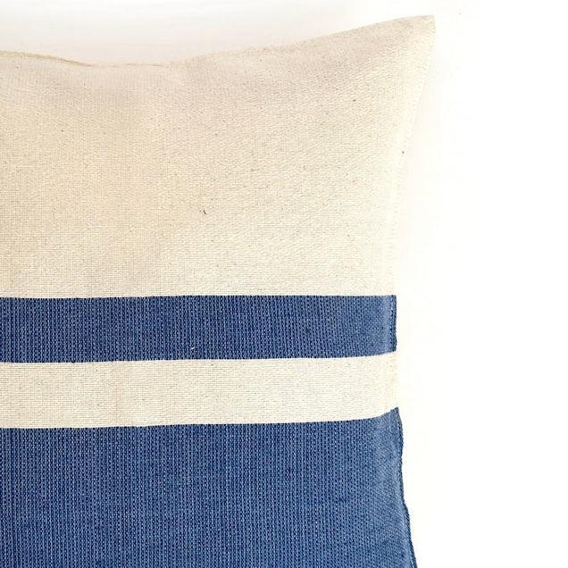 close up of blue and white striped pillow