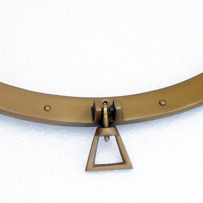 a close up of a metal object on a white surface