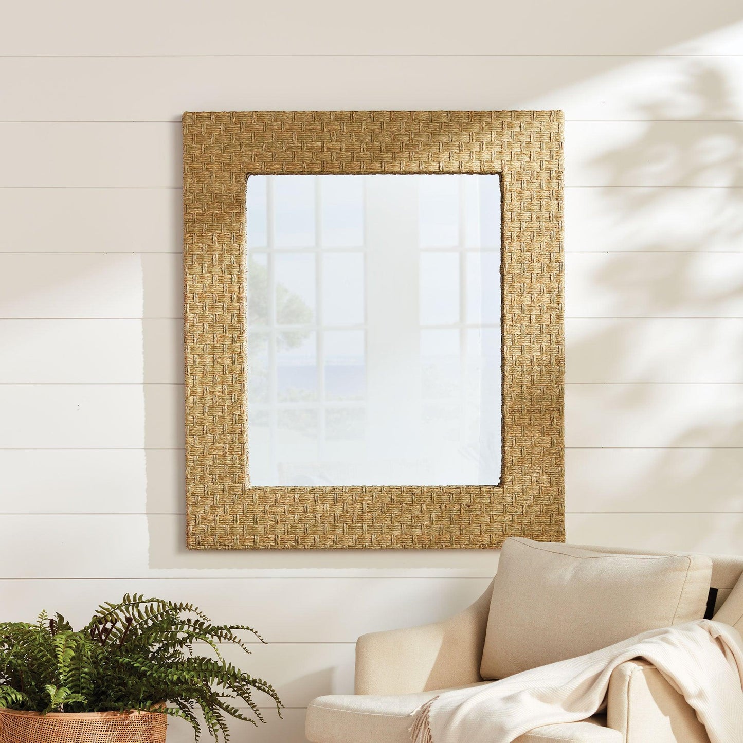 Natural fiber mirror on a shiplap wall 