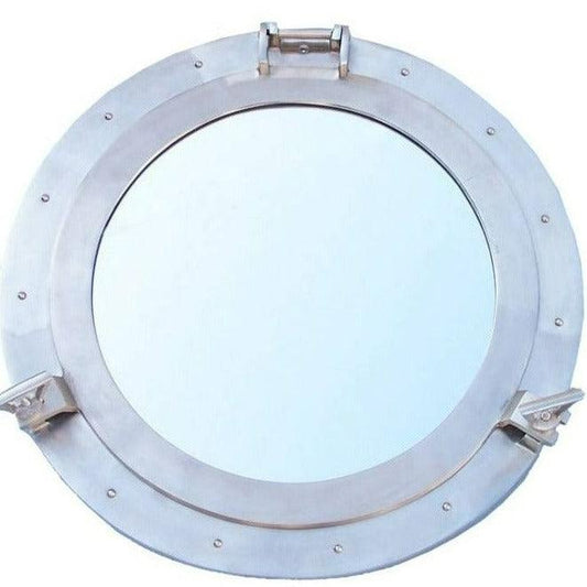 a metal porthole mirror on a white background