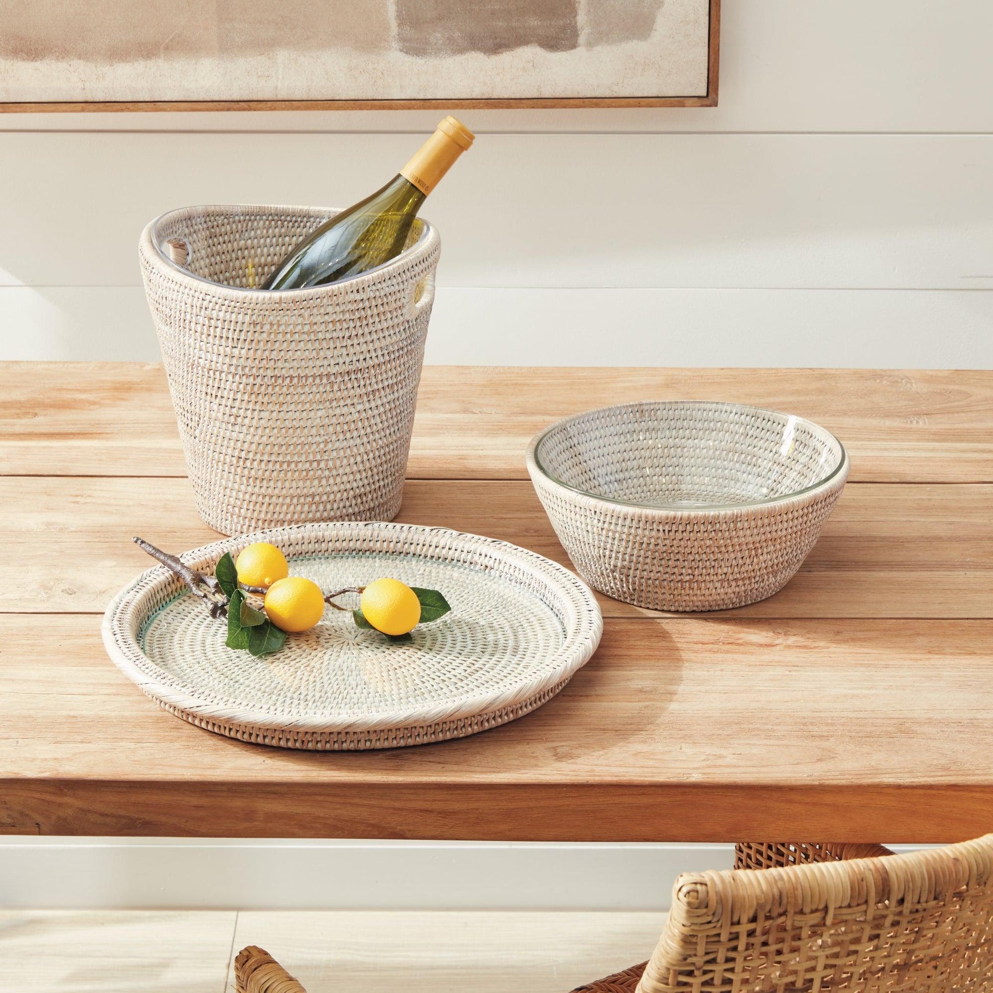 Rattan ice bucket, tray and bowl on wood table 