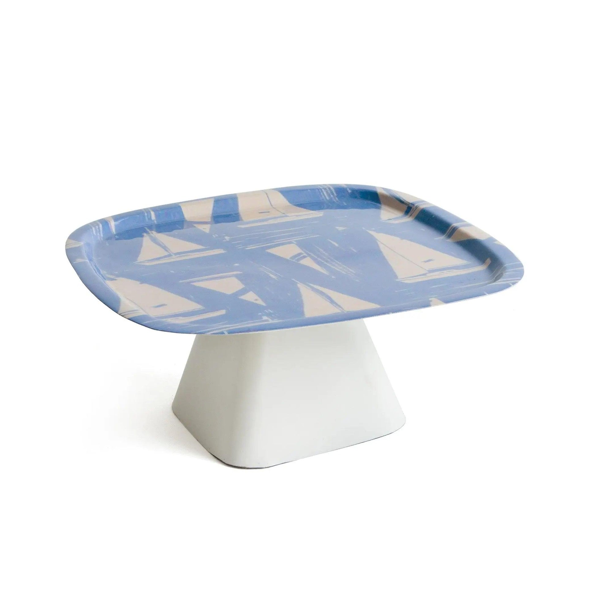 white stand with blue plate with sail boat print