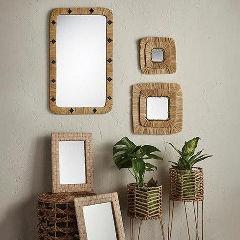 a group of mirrors sitting on top of a table