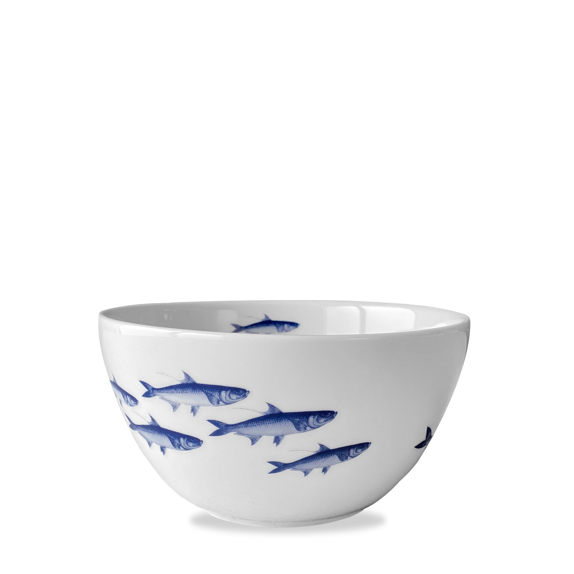 a white bowl with blue fish on it