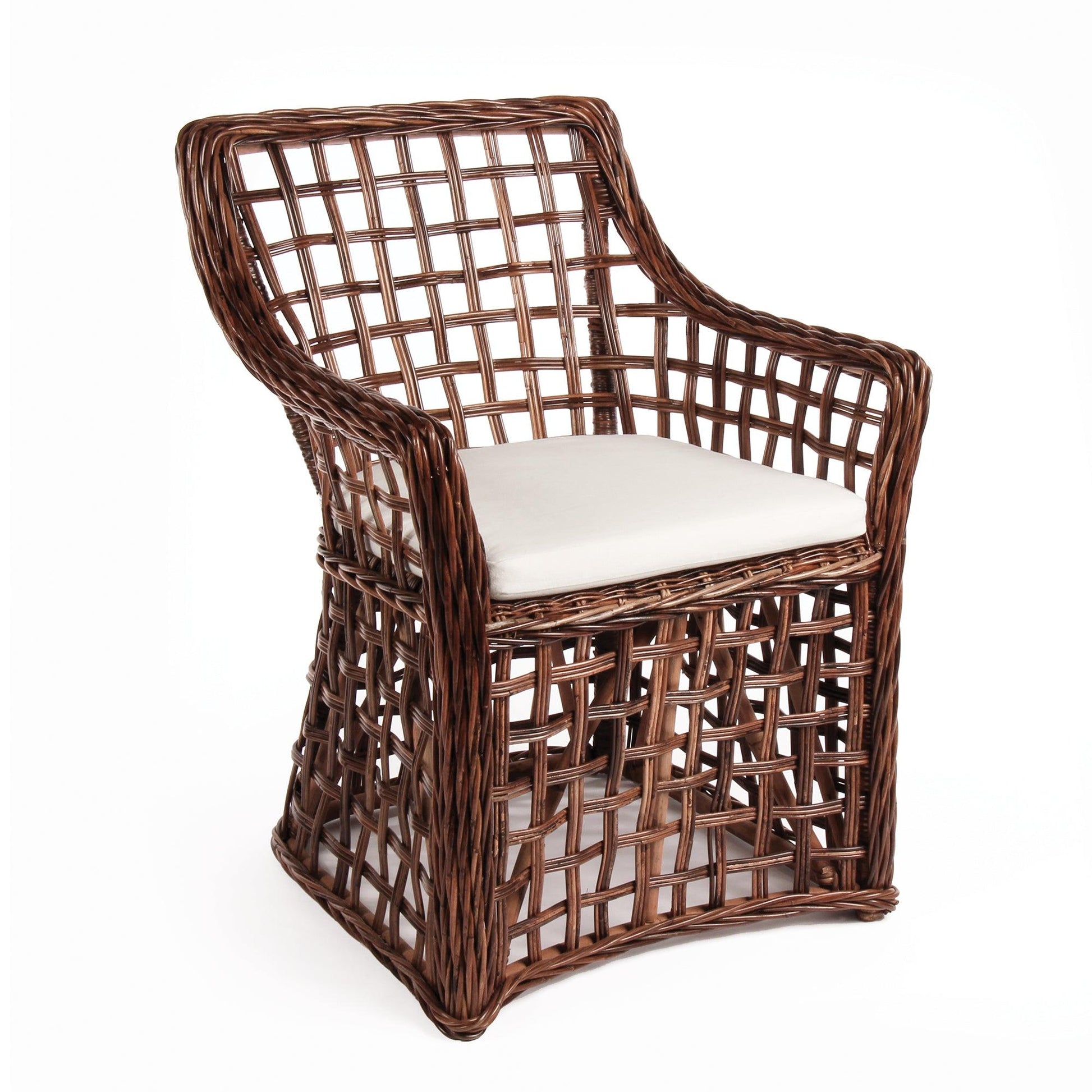 a brown wicker chair with a white cushion