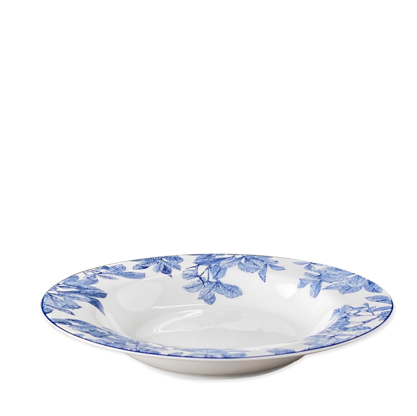 white bowl with blue leaves