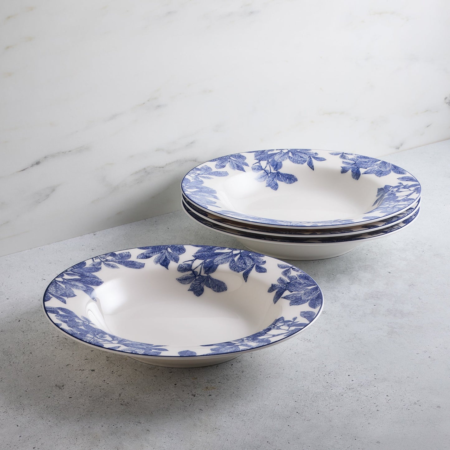 set of four blue and white bowls