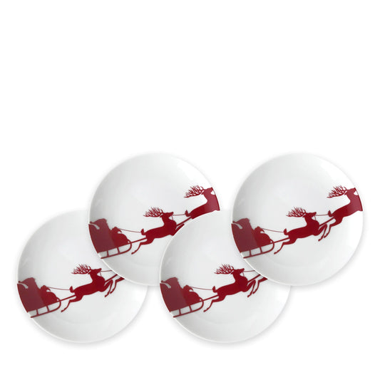 four white plates with red santa sleigh 