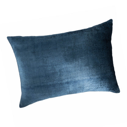 	Angled view of the Coastal Blue velvet pillow cover showing its sheen and rectangular shape
