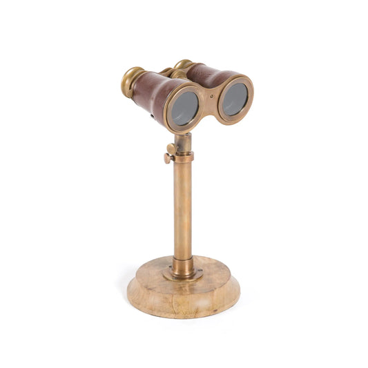 gold binoculars on a stand