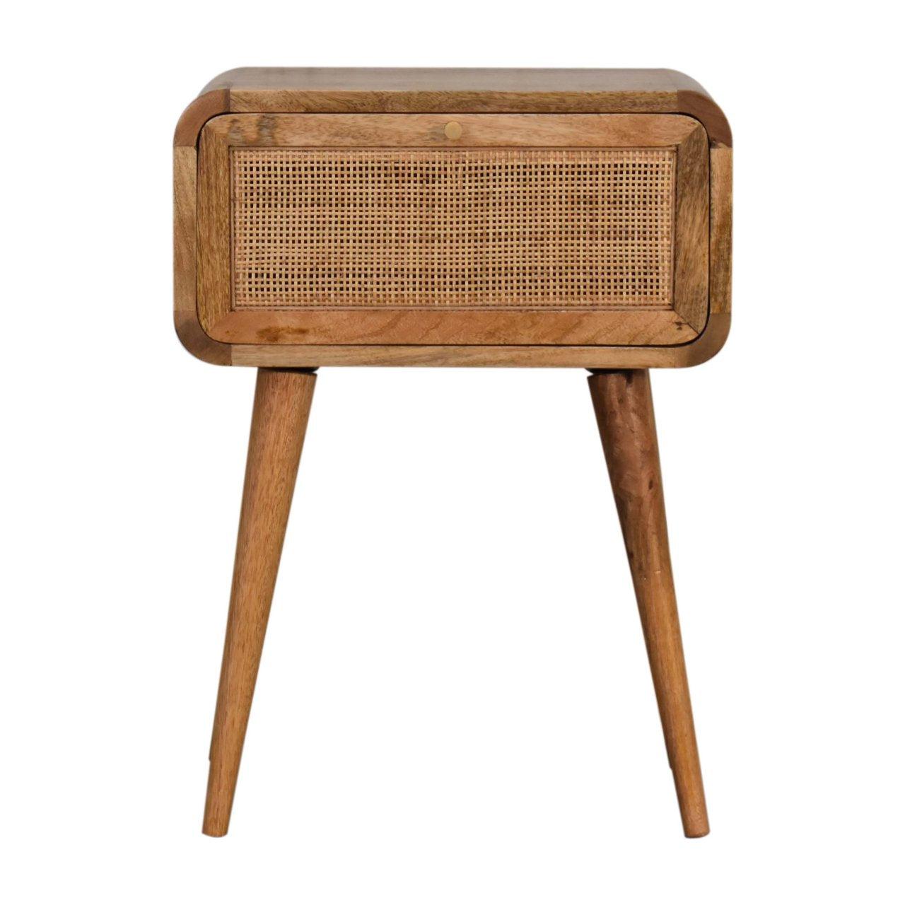 a wooden and wicker side table with a drawer