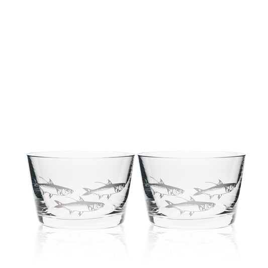 a couple of glasses sitting next to each other