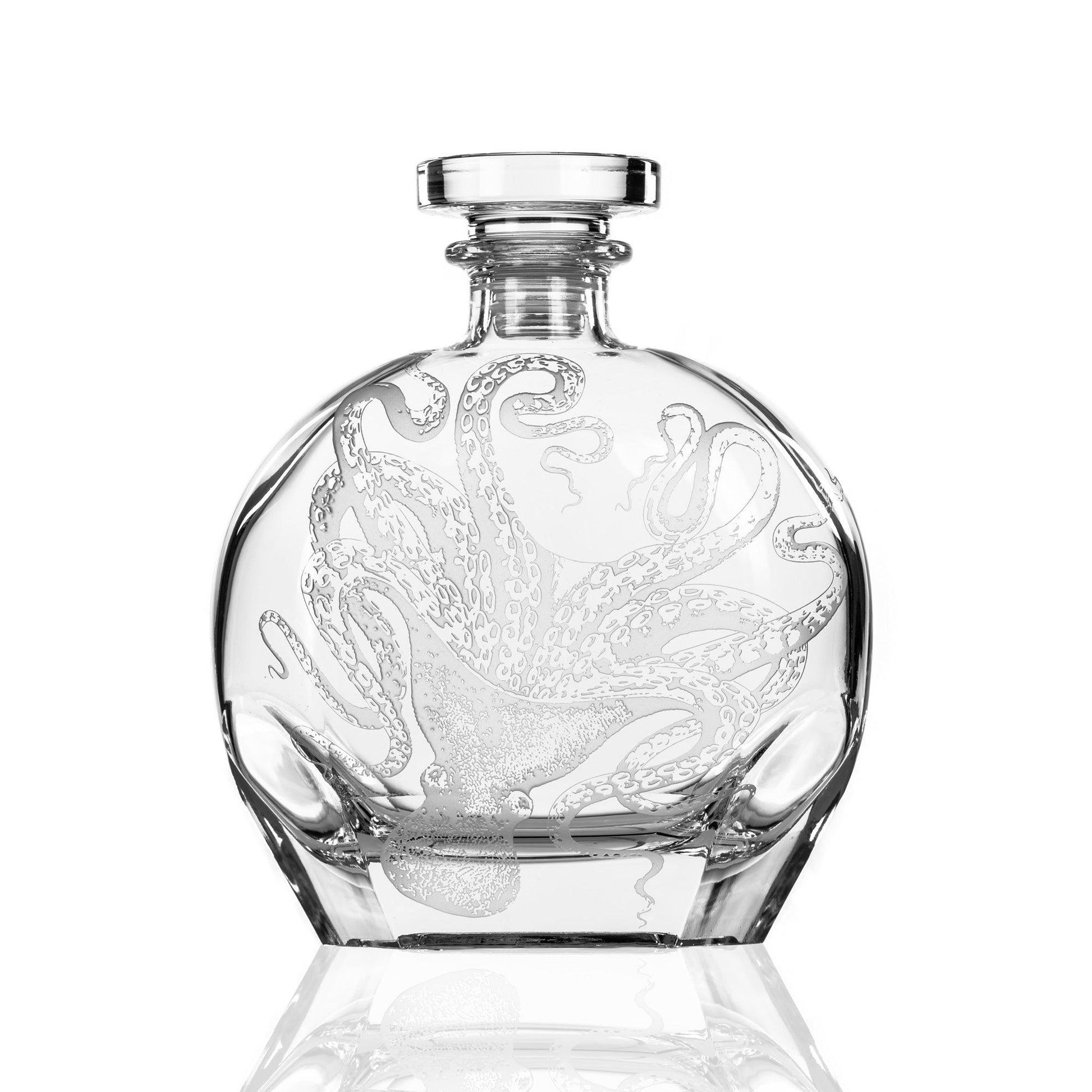 a crystal decanter with an octopus on it