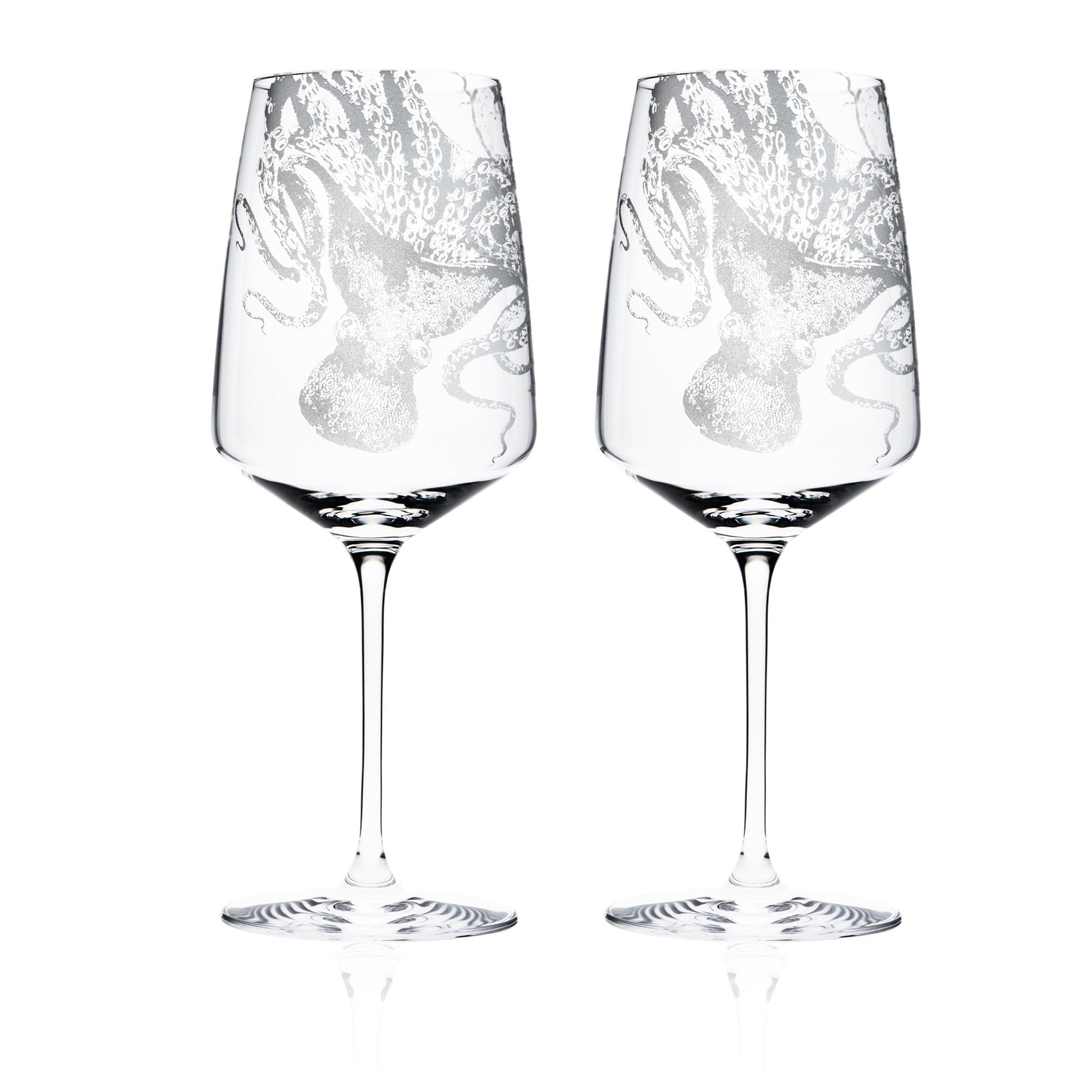 a couple of wine glasses sitting next to each other