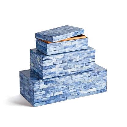 Three blue decorative boxes stacked