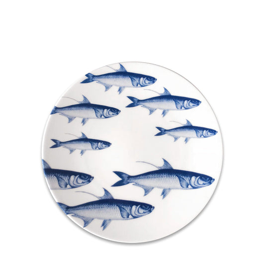 a blue and white plate with fish on it