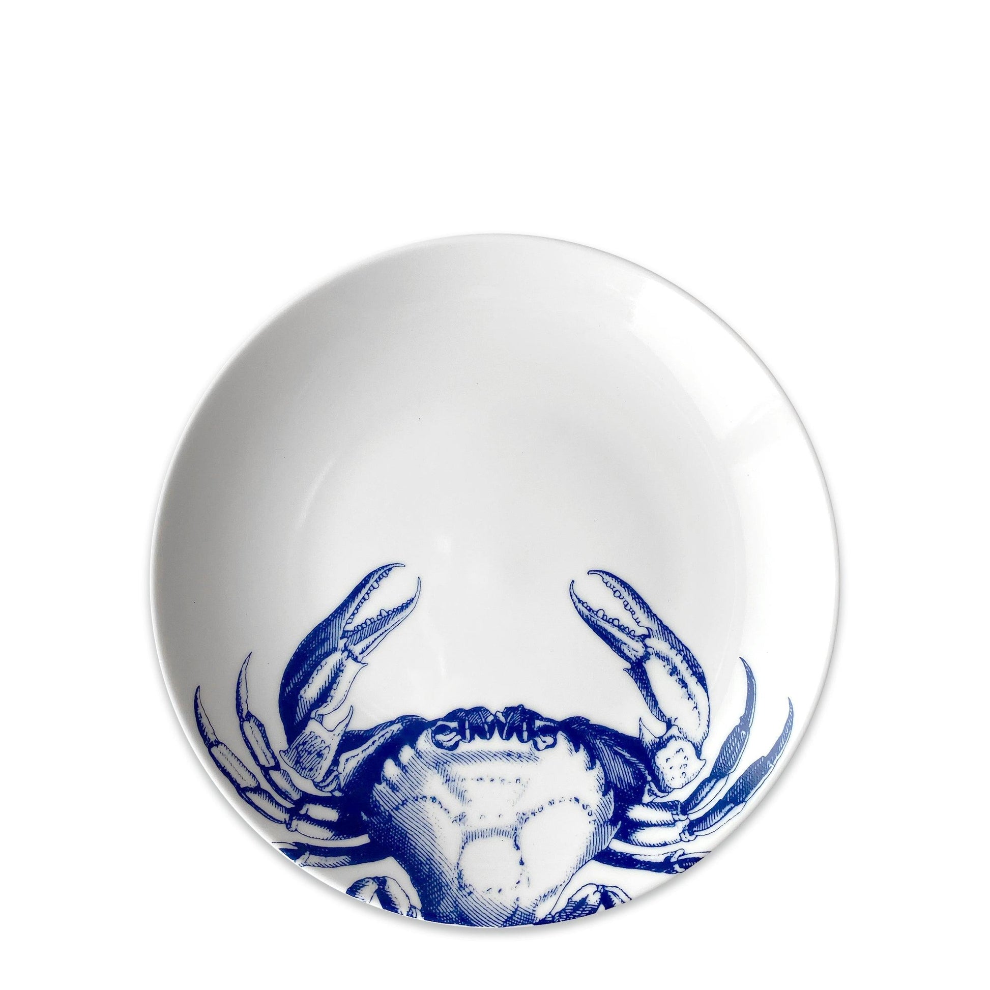 a blue and white crab bowl on a white background