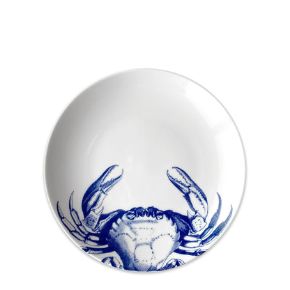 a blue and white crab bowl on a white background