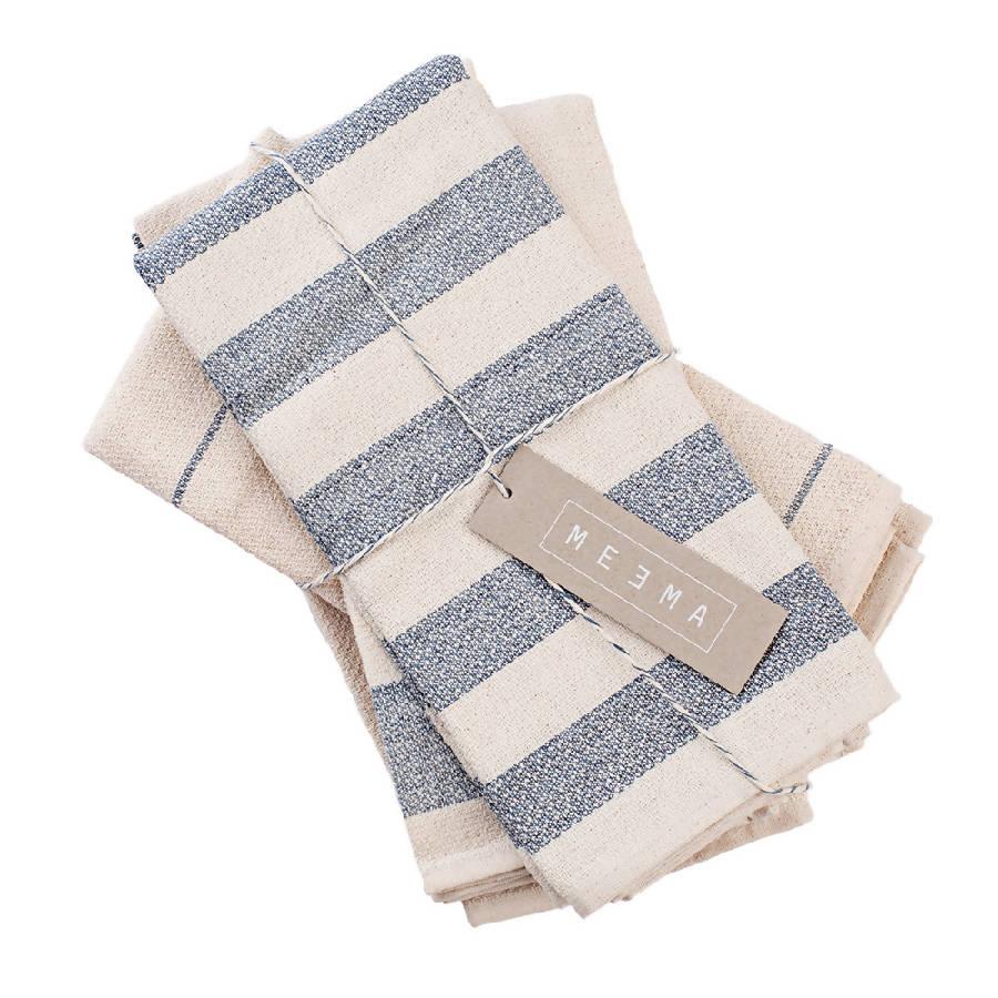 a stack of blue and white striped napkins