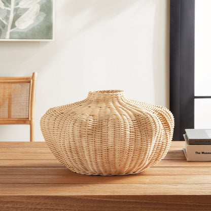 Wicker vase on wood table 
