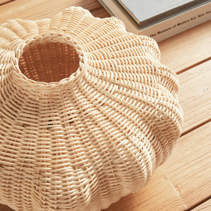 Close up of wicker vase on wood table 