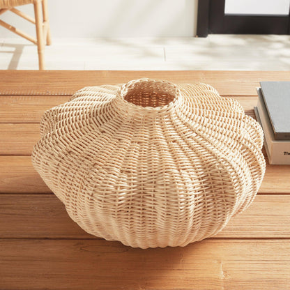 Wicker vase on wood table 