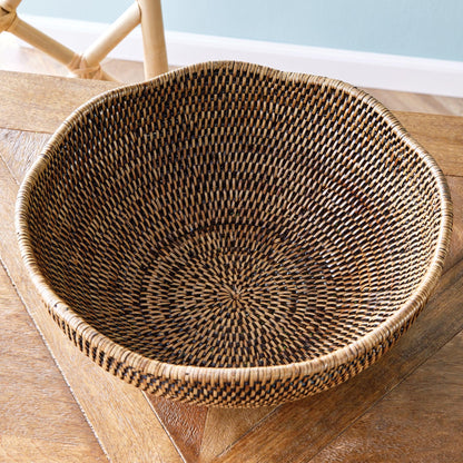 Rattan bowl atop a wood table 