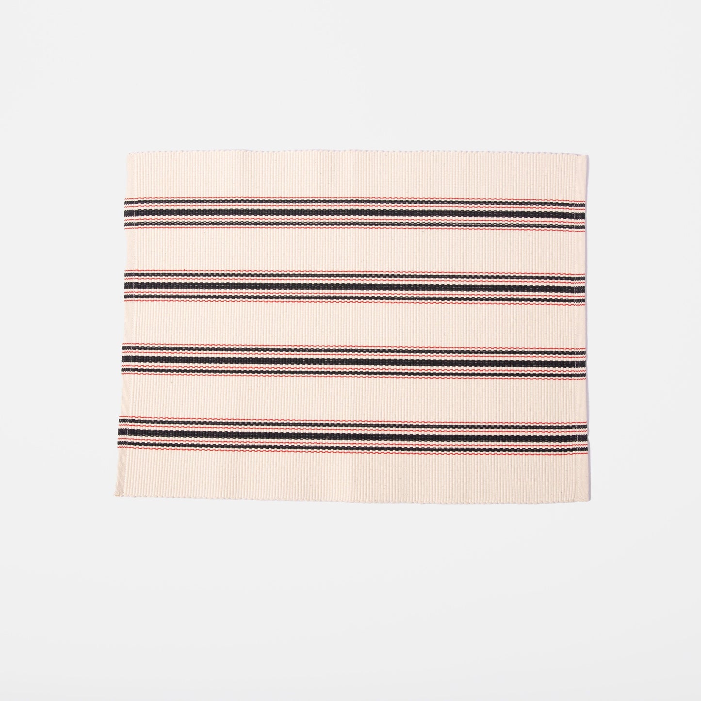 white placemat with red and blue stripes