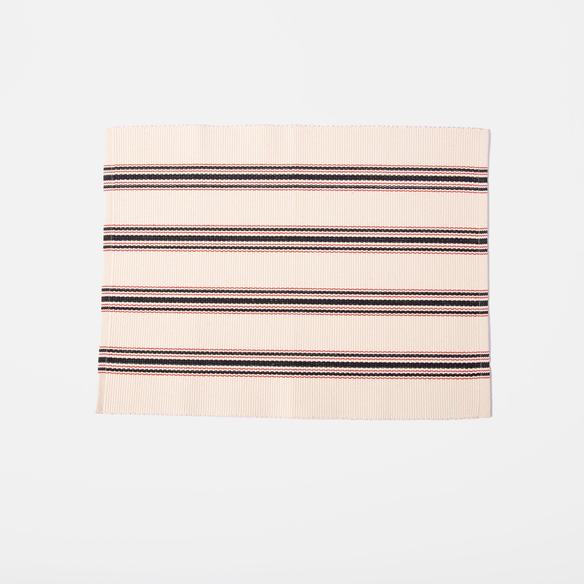 white placemat with red and blue stripes