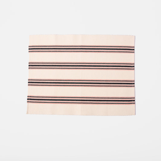white placemat with red and blue stripes