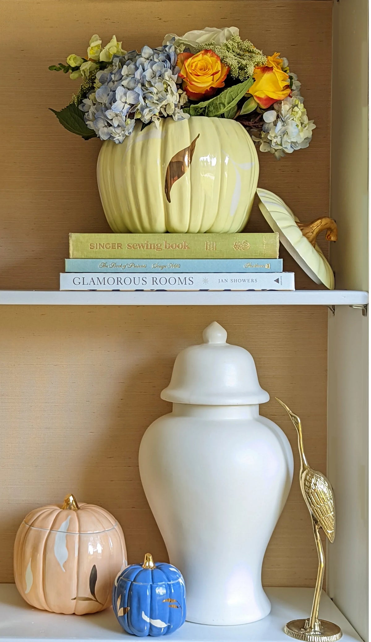 Blue ceramic pumpkin jars with hand-applied gold accents