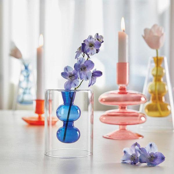 Four multi colored glass candle holders