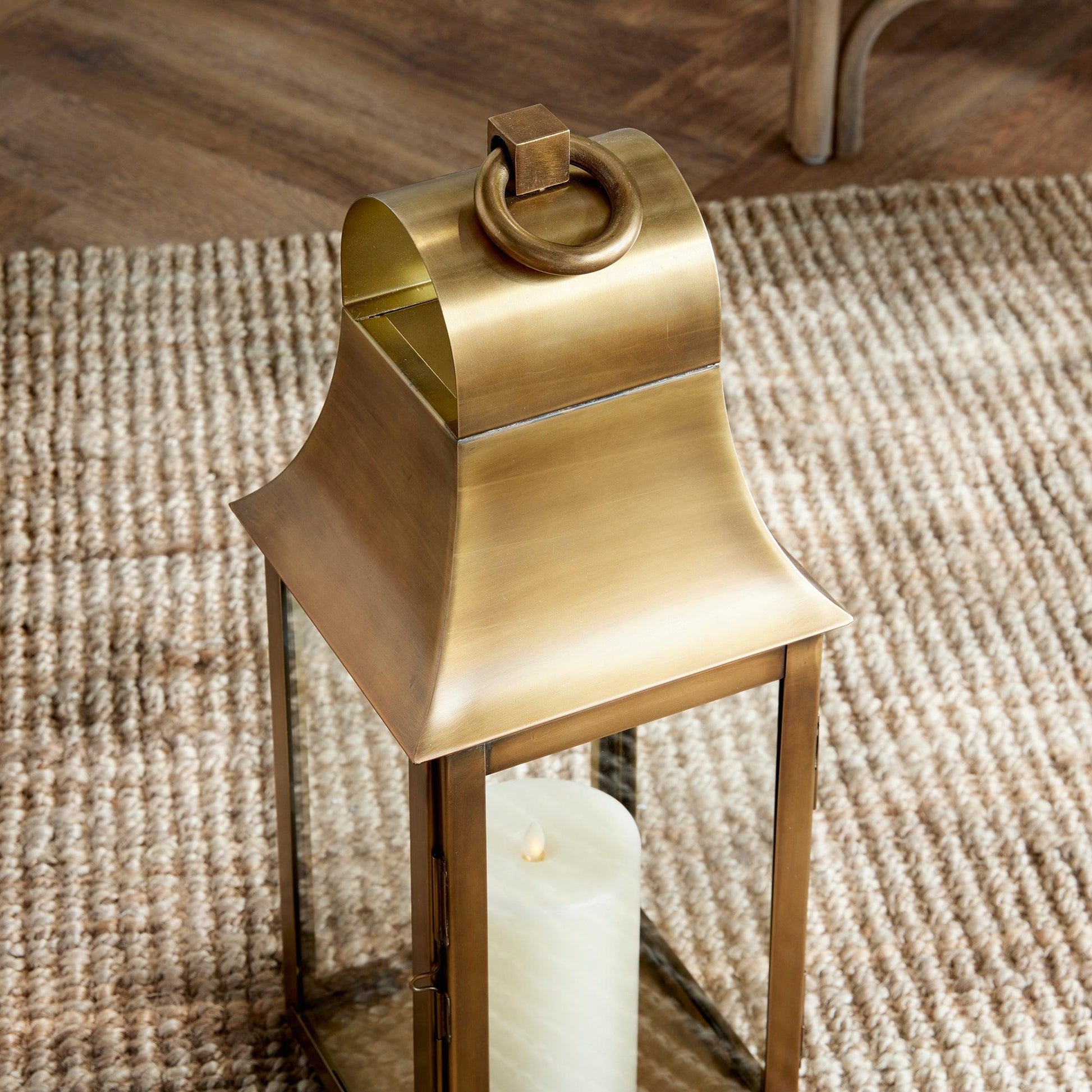 Close up of gold lantern on a rug