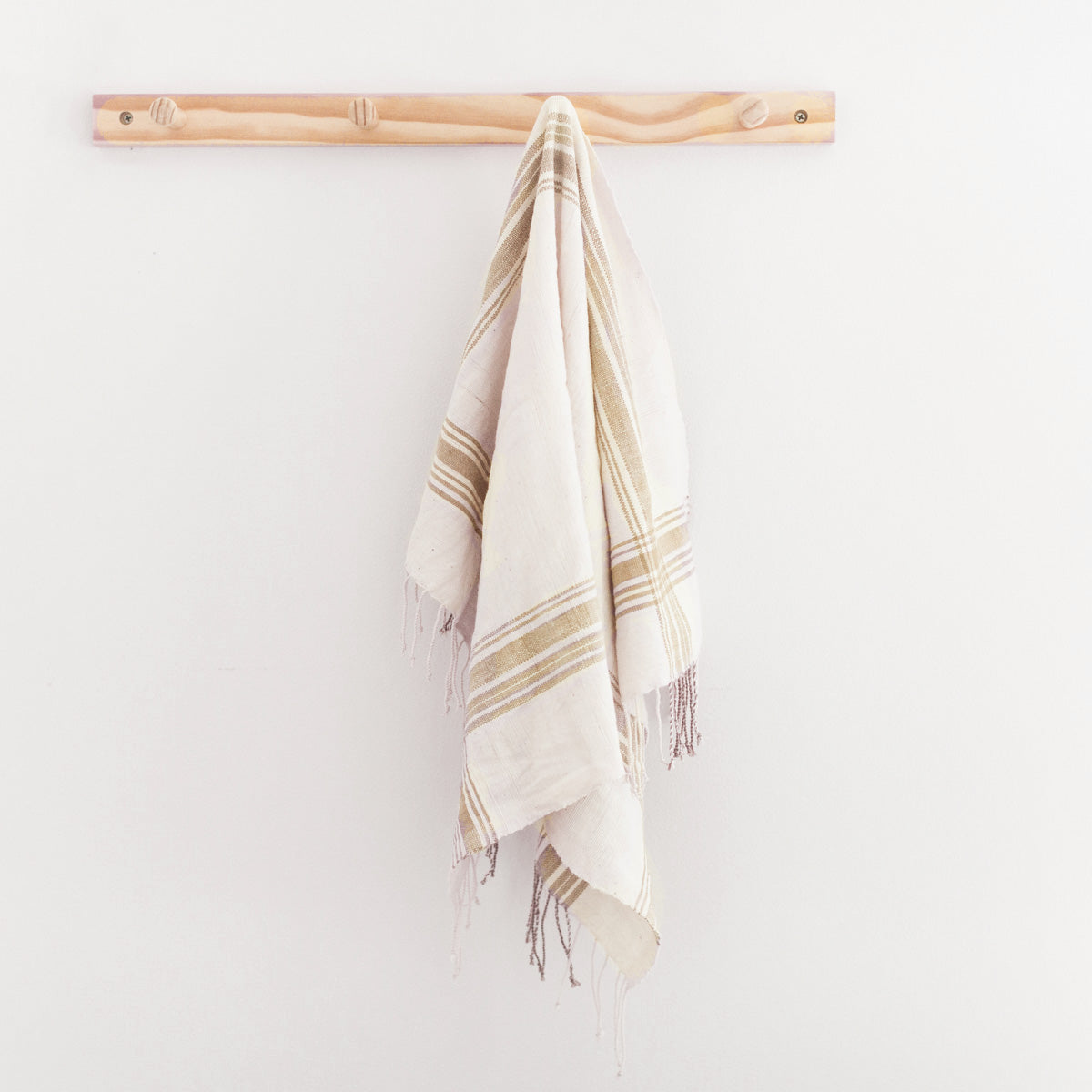 white and beige hand towel