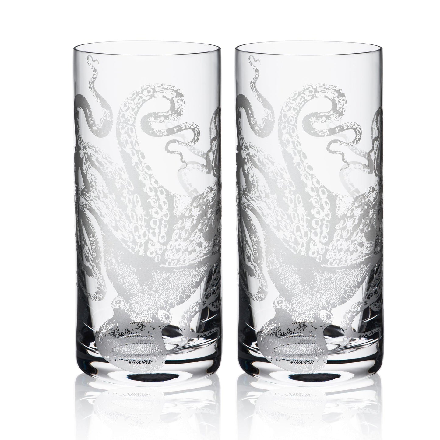 a couple of highball glasses sitting next to each other