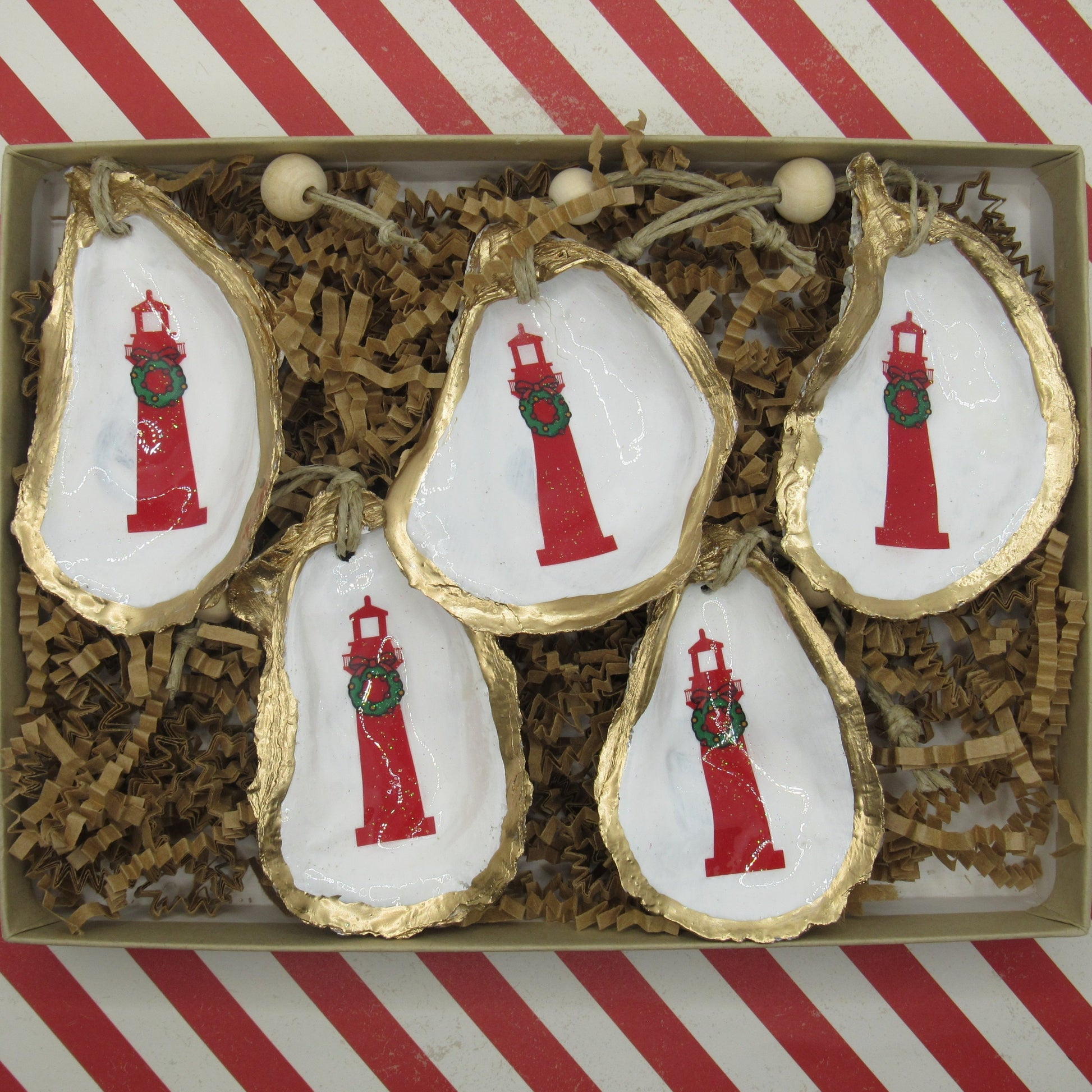 5 christmas lighthouse shell ornaments in a box