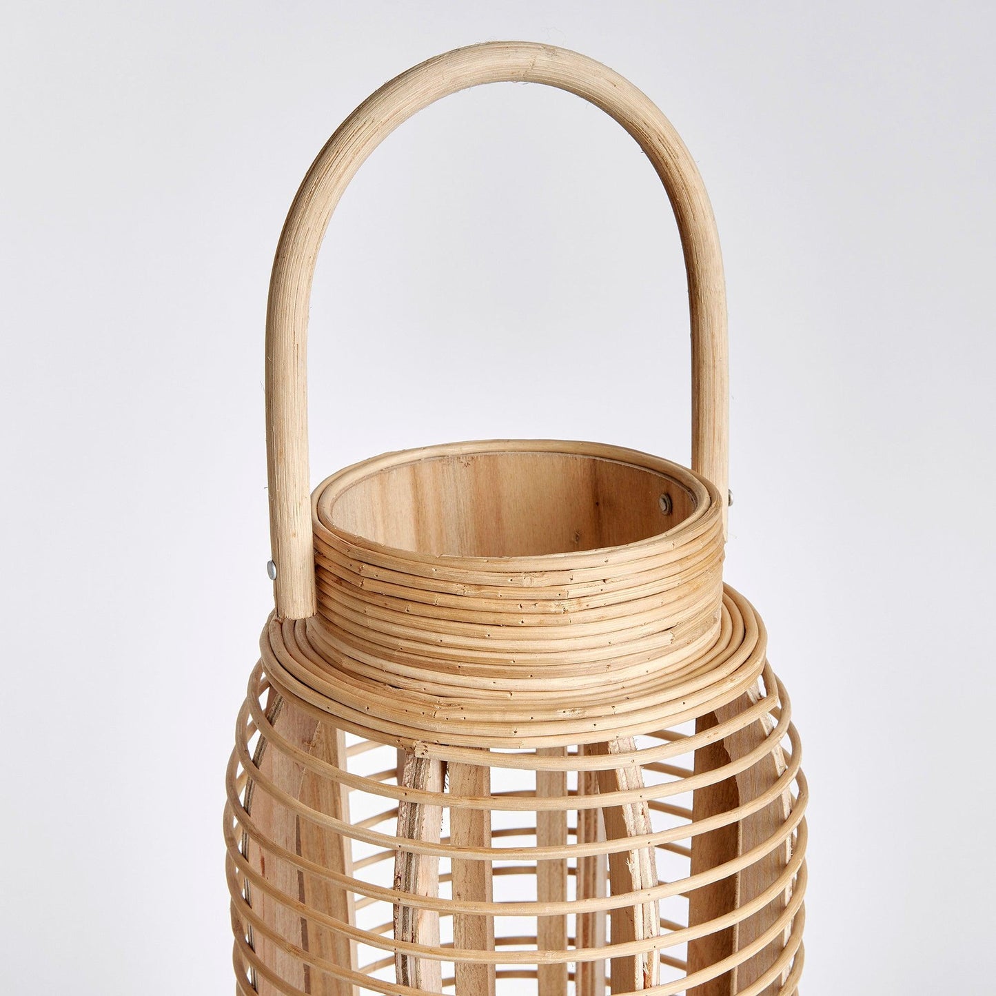 a wooden basket with a handle on a white background