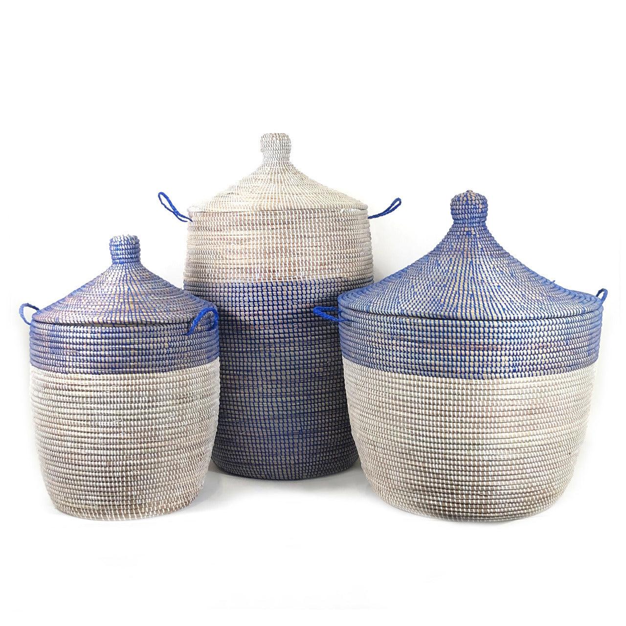 three blue and white baskets sitting next to each other