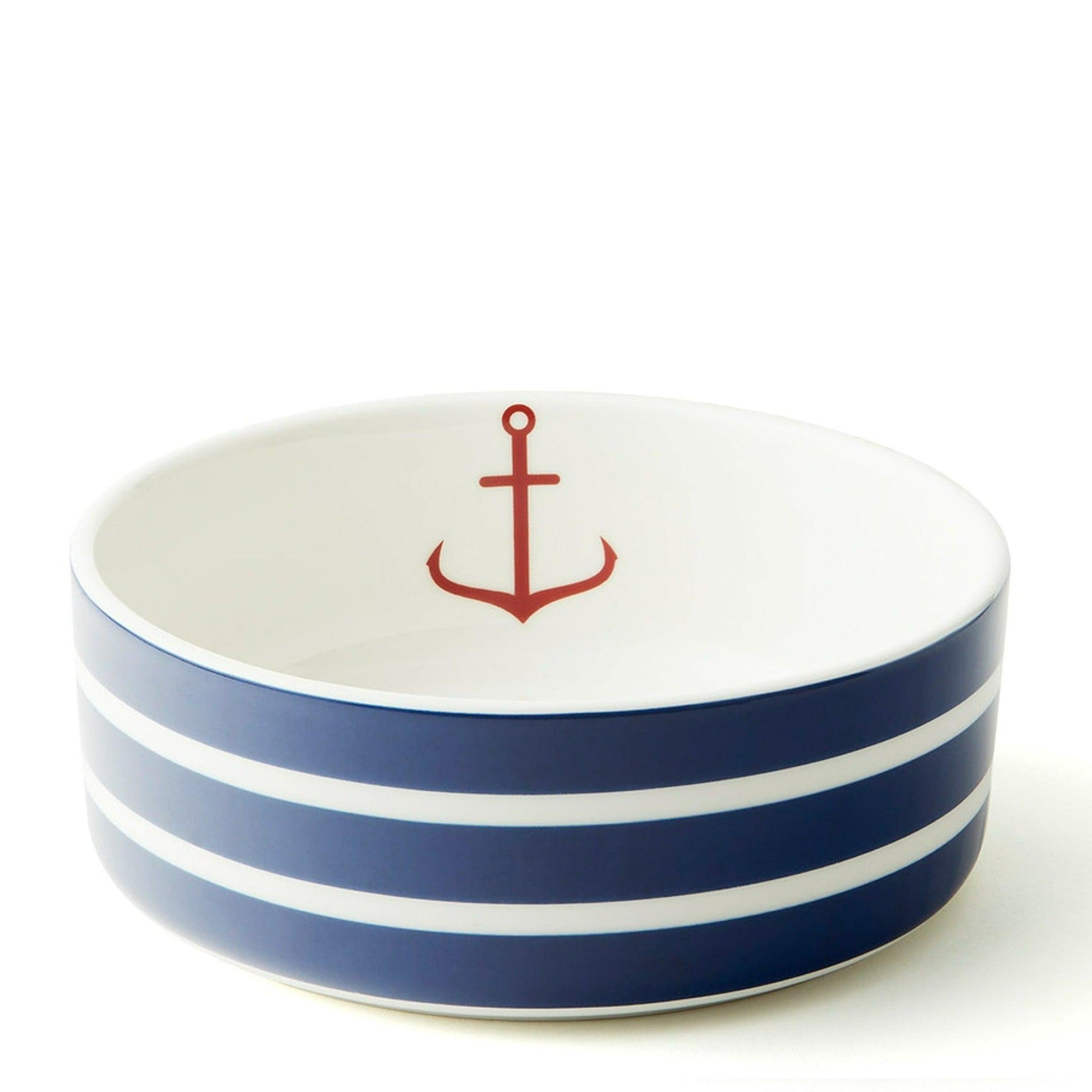 a blue and white bowl with a red anchor on it