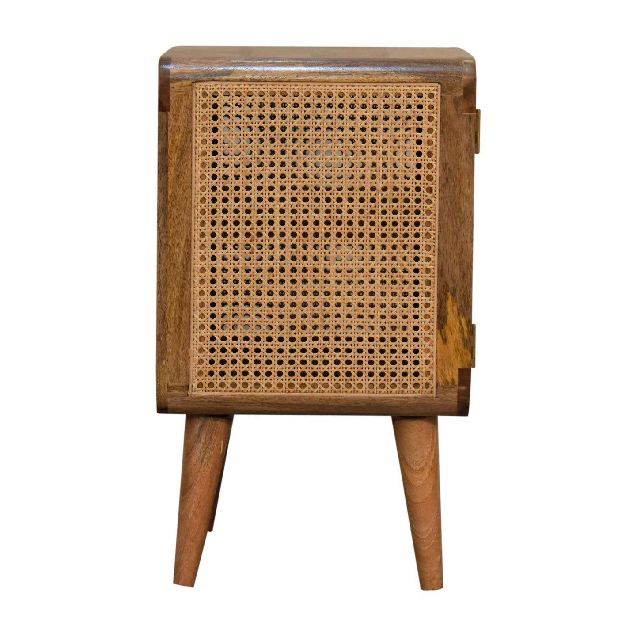 a small wooden cabinet with a rattan design