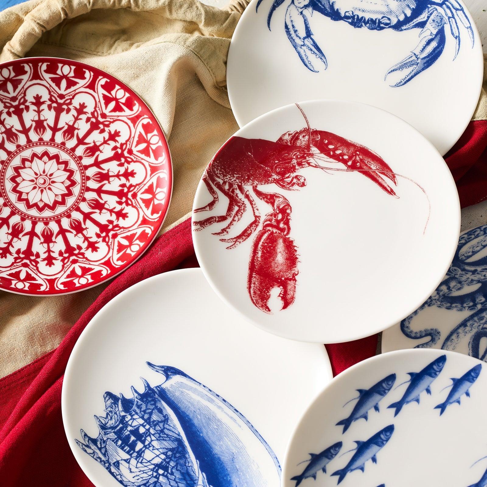 a pile of plates with blue and red designs on them