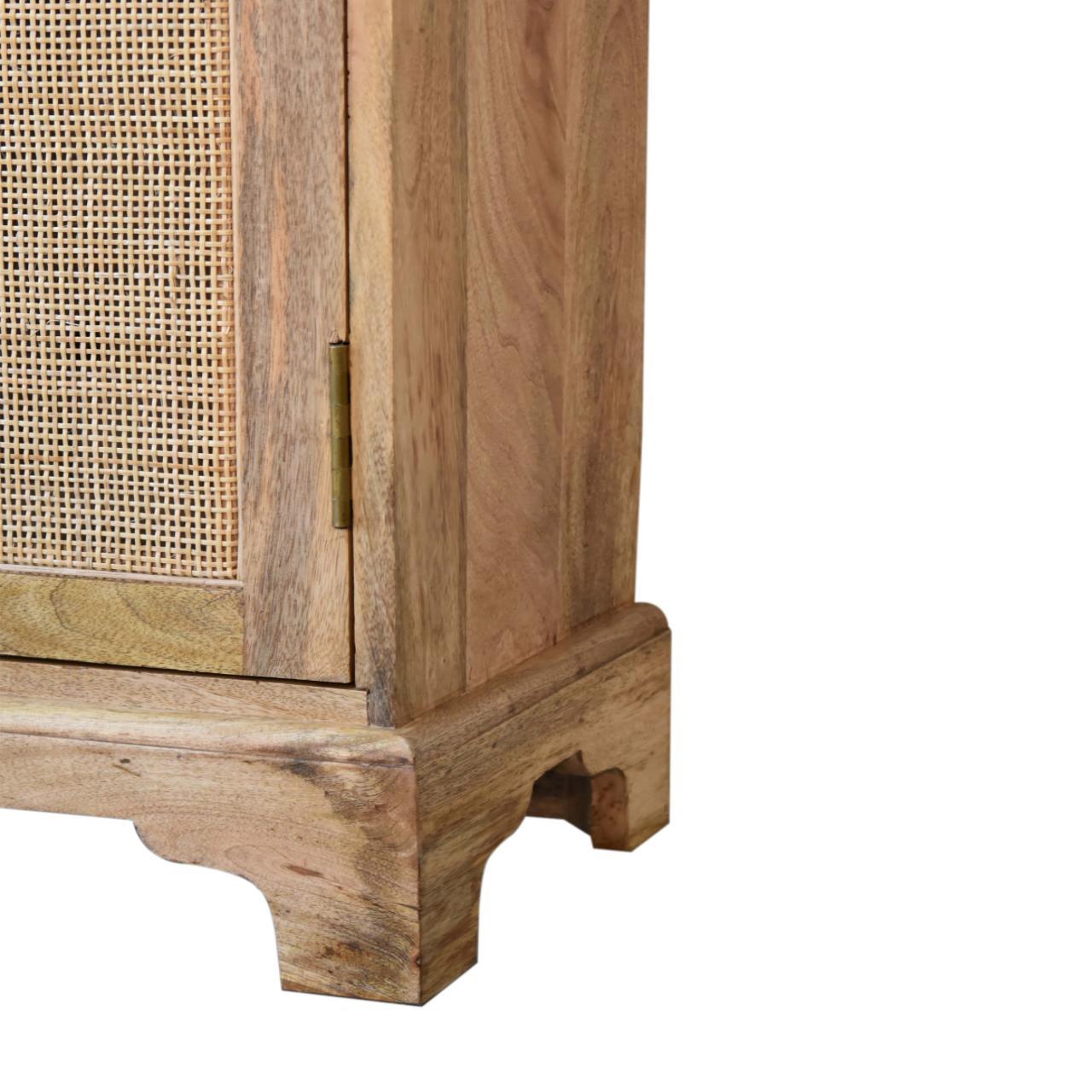 a wooden cabinet with a rattan door