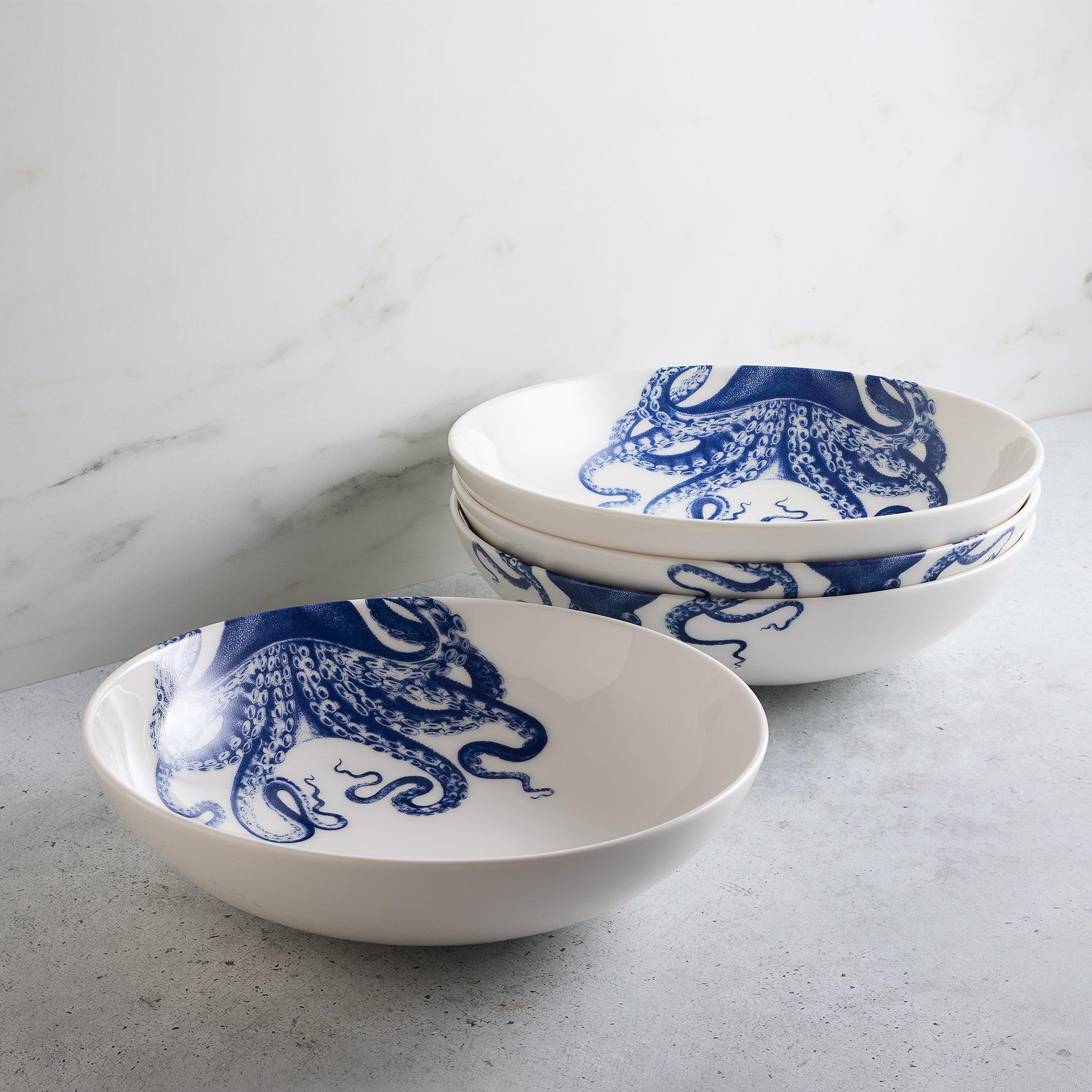 a set of three blue and white bowls