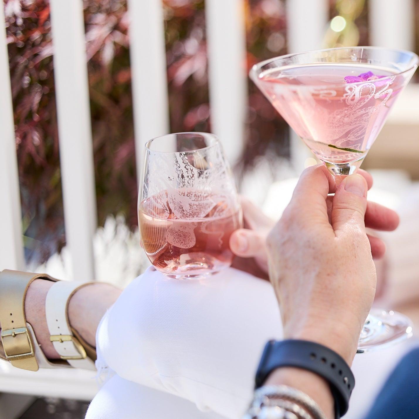 a person holding a wine glass in their hand